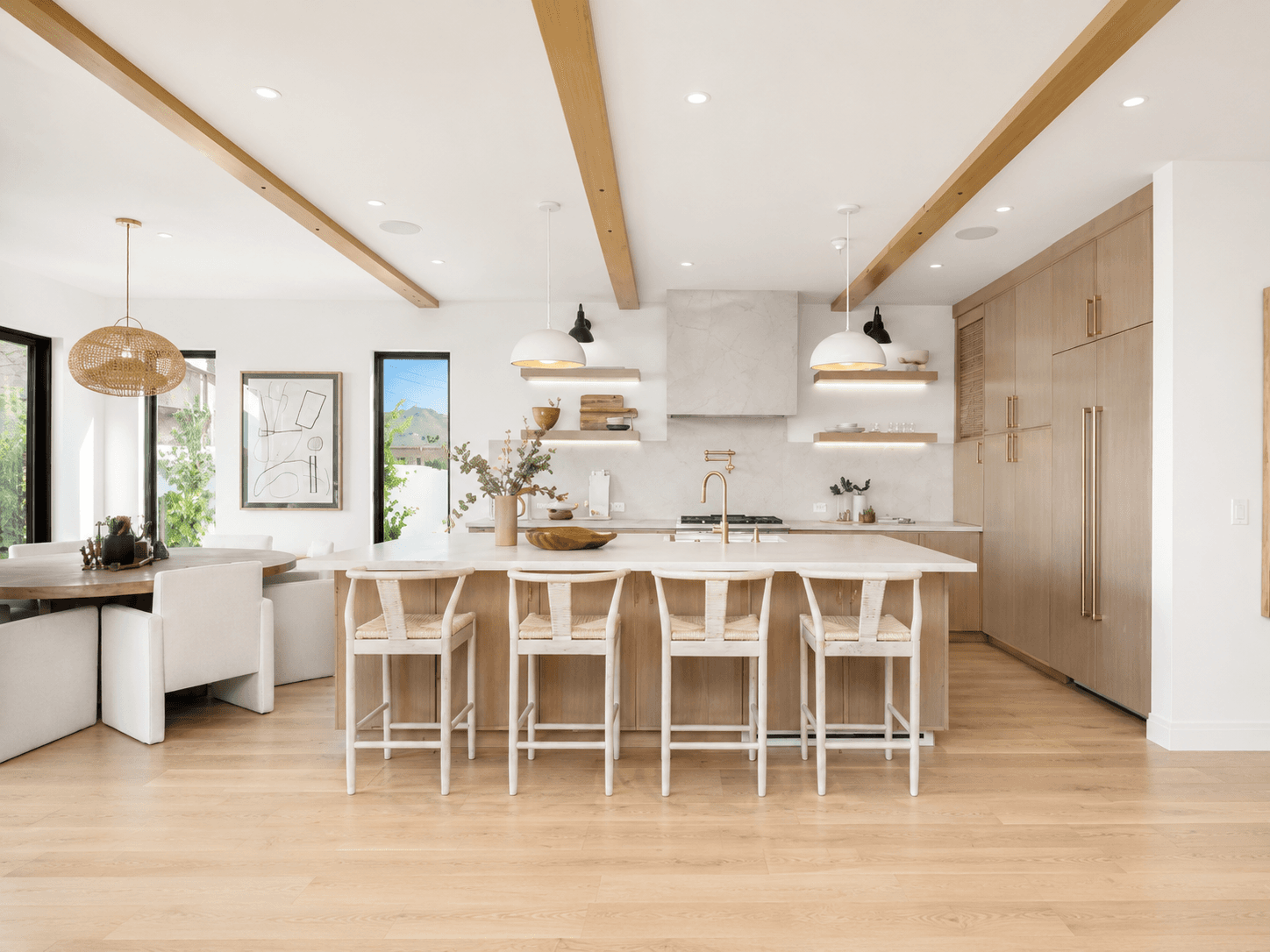 Bright finished kitchen with a large island and warm timber details