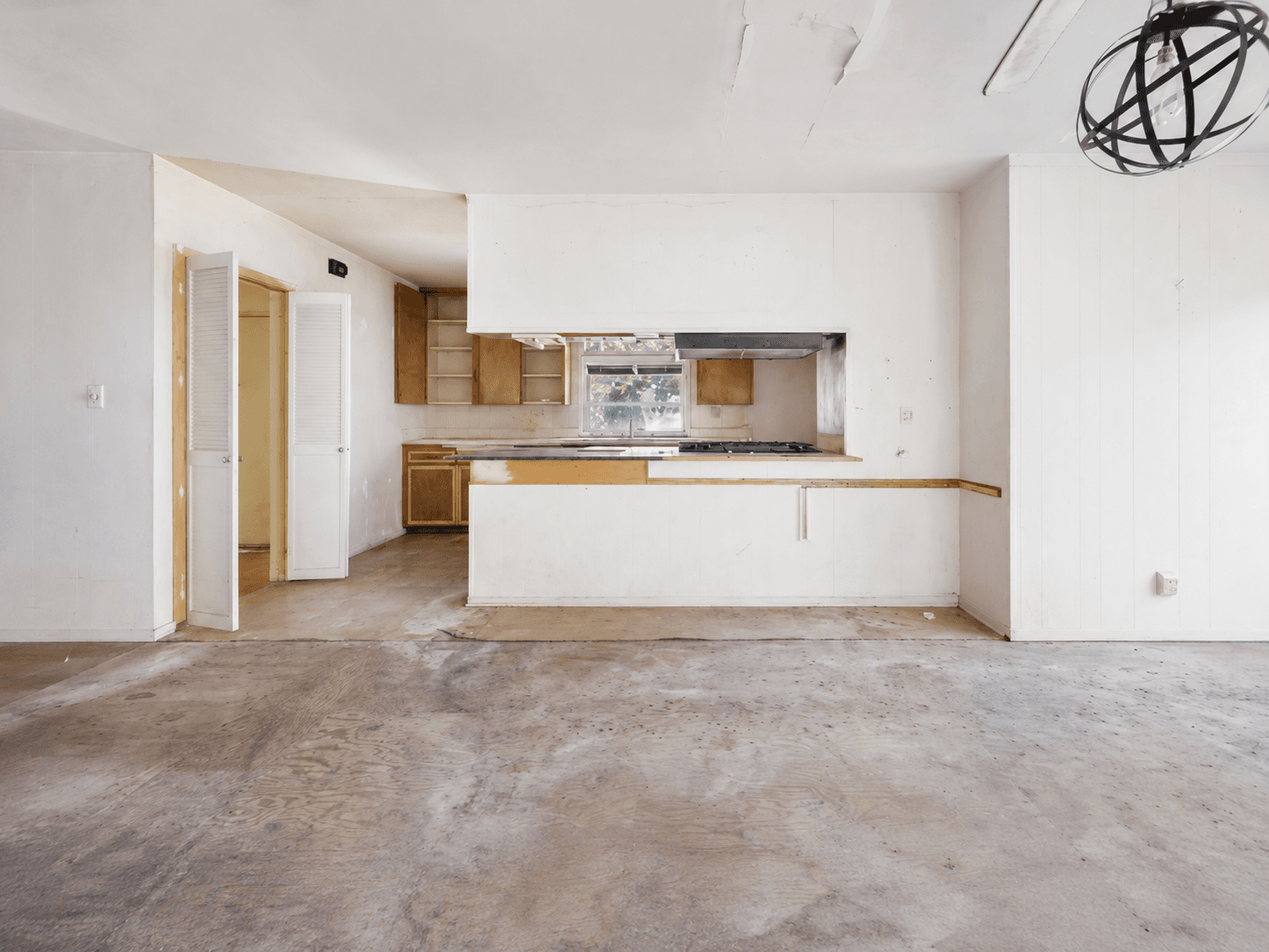 Original kitchen and living space before the complete renovation
