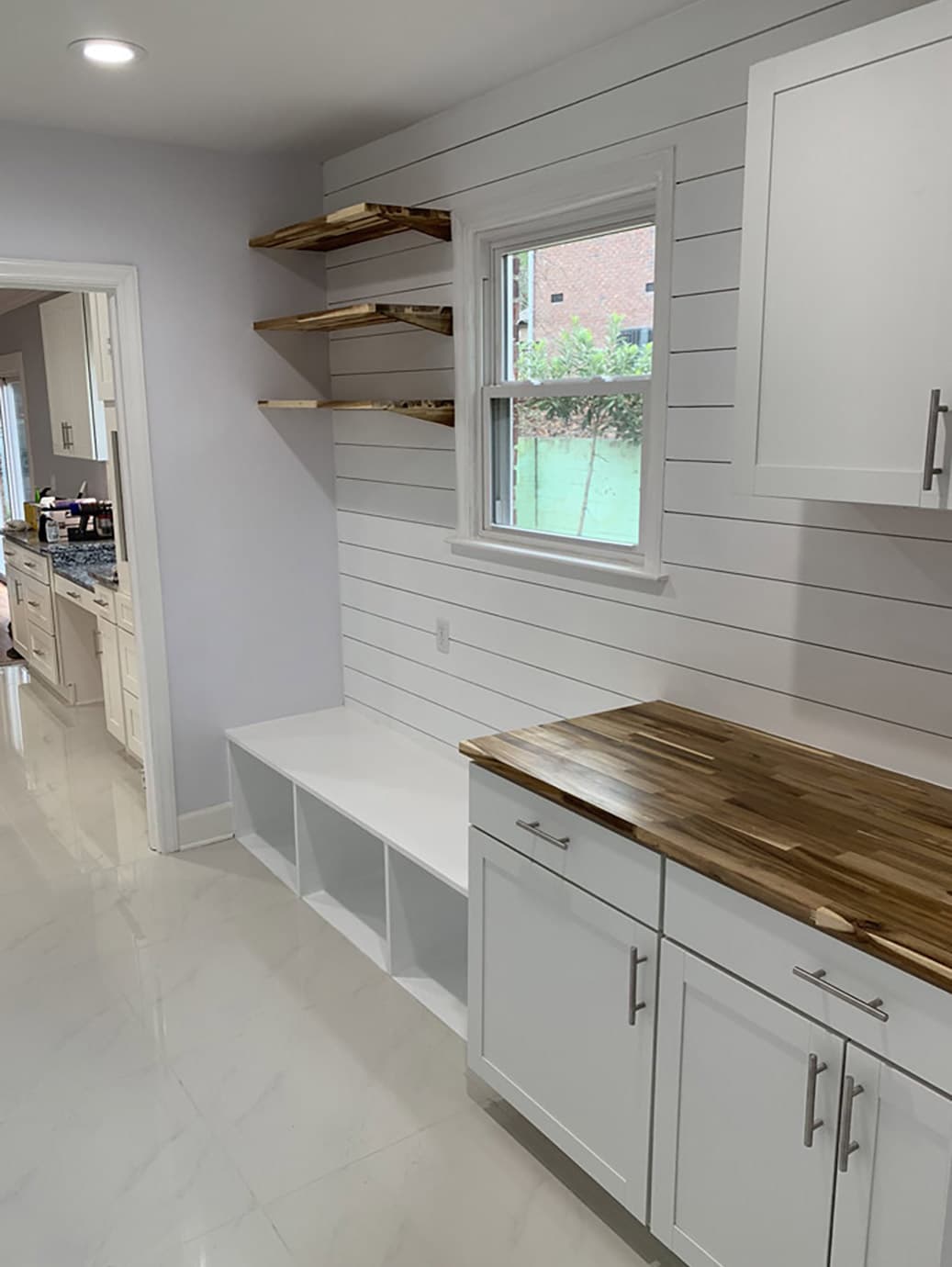 Completed Allison Builders mudroom with timber worktop and open shelving