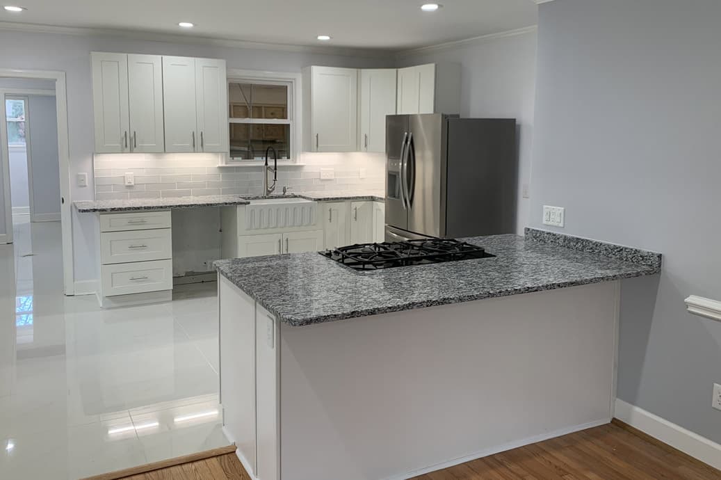 Completed Allison Builders kitchen with a large stone island